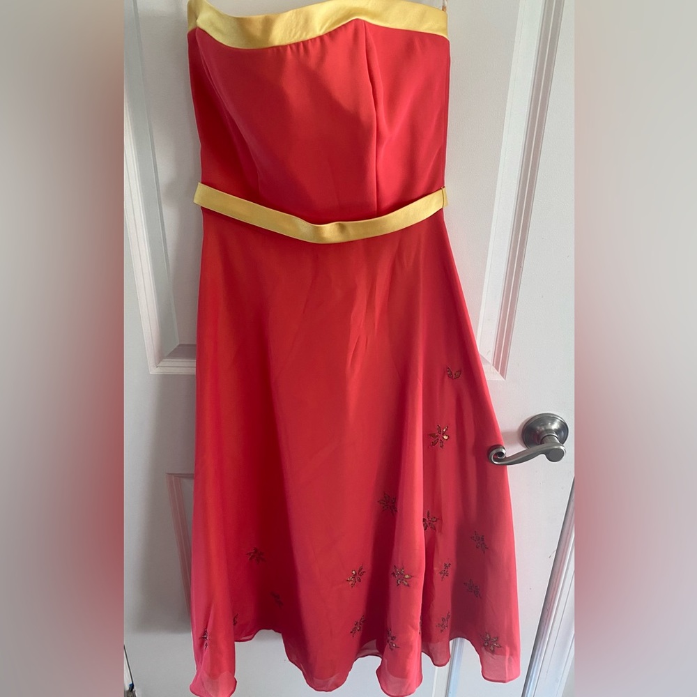 Brand new knee length strapless dress